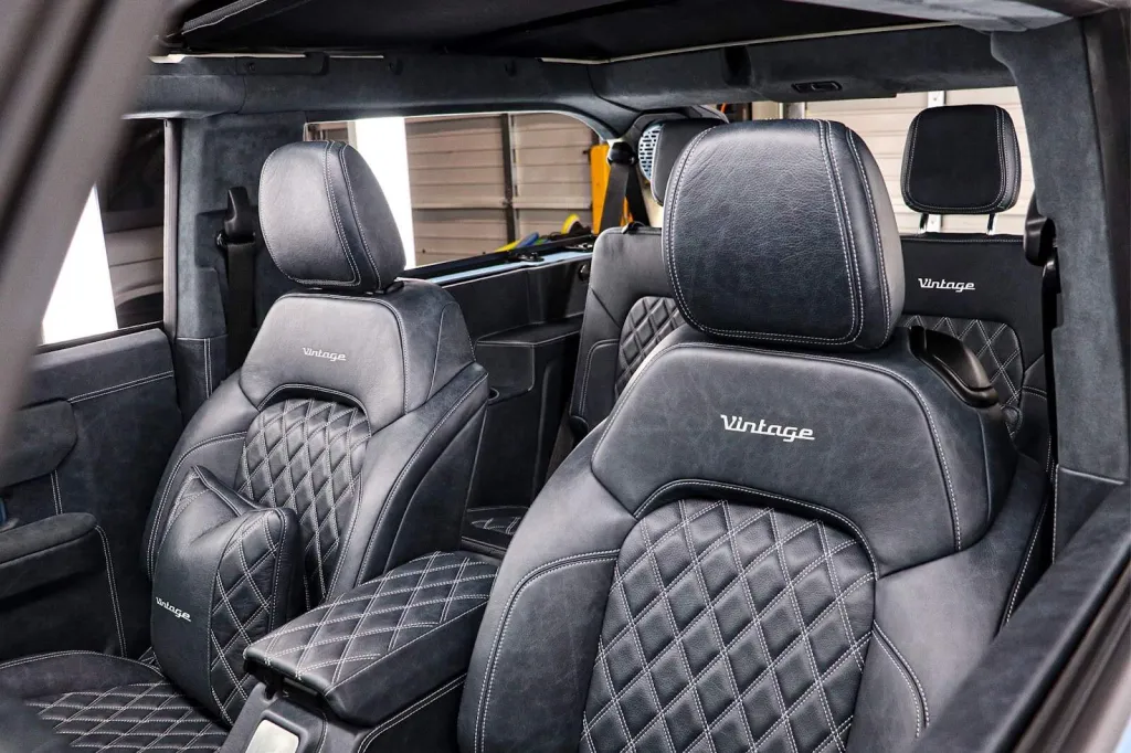 Luxurious black leather custom car seats with diamond stitching, labeled "Vintage," inside a vintage-modern vehicle interior. Perfect for a stylish, nostalgic automotive upgrade.
