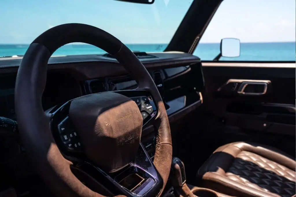 Vintage modern classic car interior with sea view, luxury cruise, stylish dashboard, leather seats, retro design, coastal driving, beach scene, vintage car decor, travel, ocean view turismo.