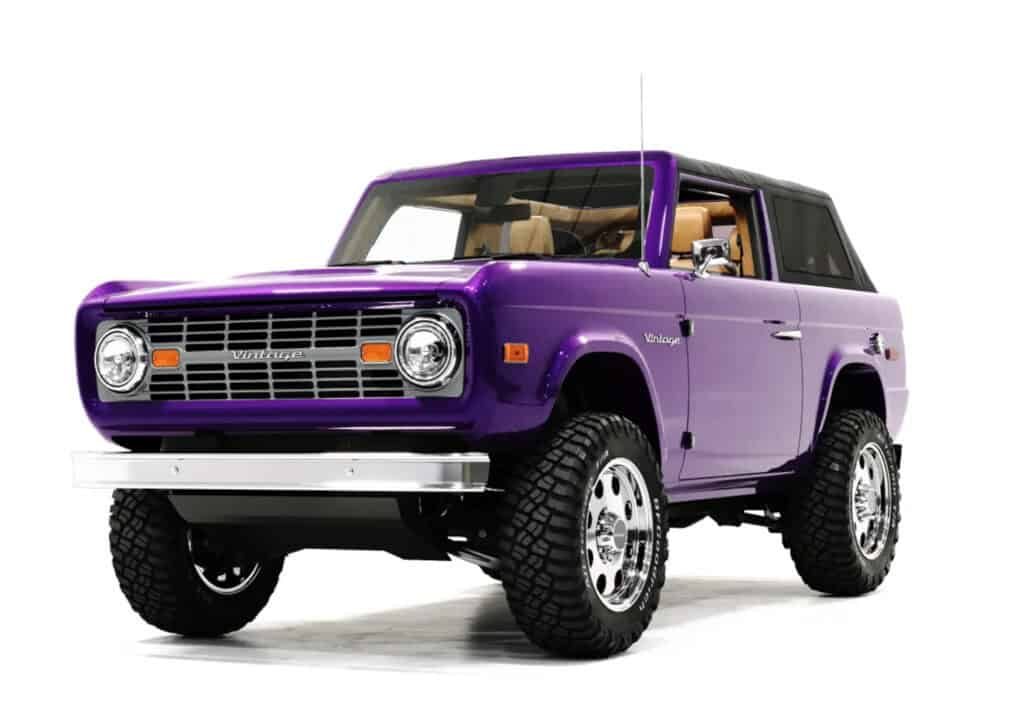 Vintage Modern purple off-road SUV with retro design, bold wheels, and classic styling, showcasing a blend of vintage and modern automotive aesthetics.